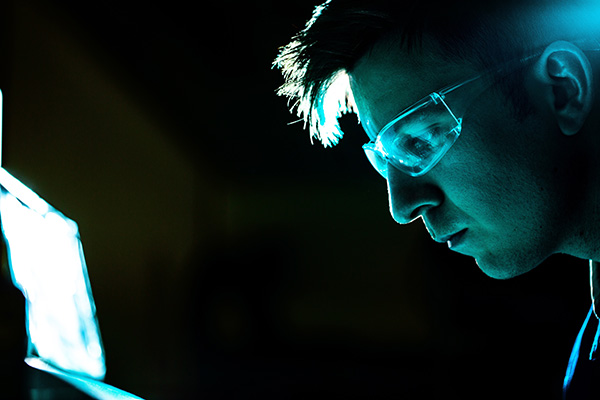 Electrical engineer inspecting product safety features such as grounding, insulation, and fuse protection