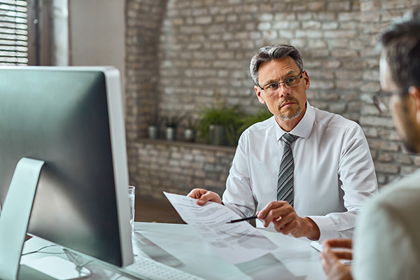 Image of a compliance officer reviewing documentation for a certified product
