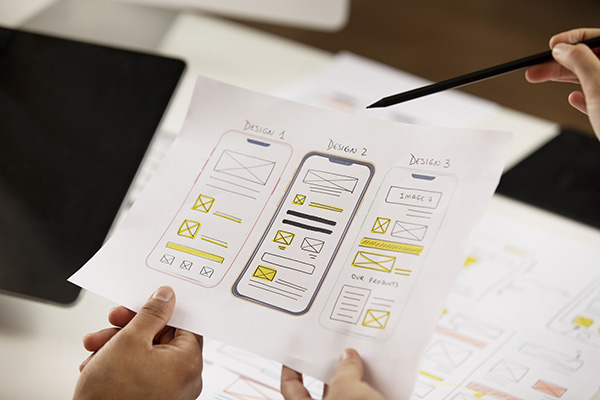 Image showing a designer working on wireframes for a mobile app