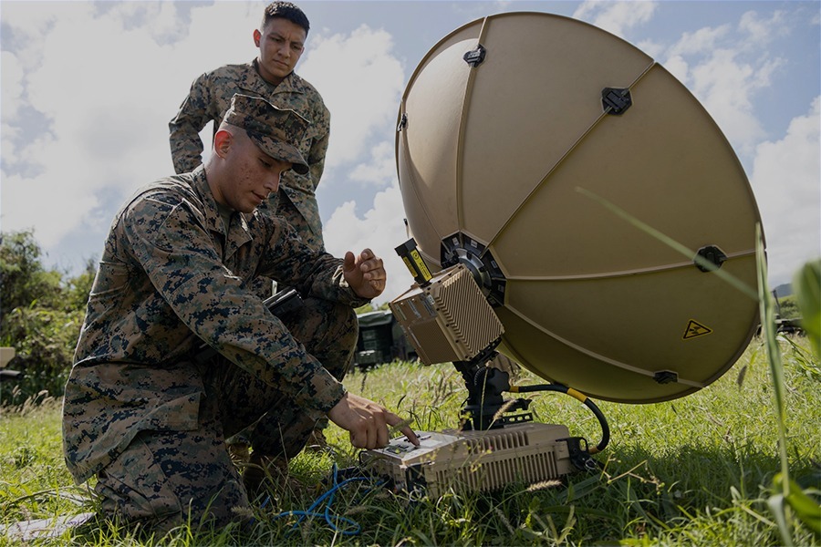 Soldier operating deployable tactical communications equipment