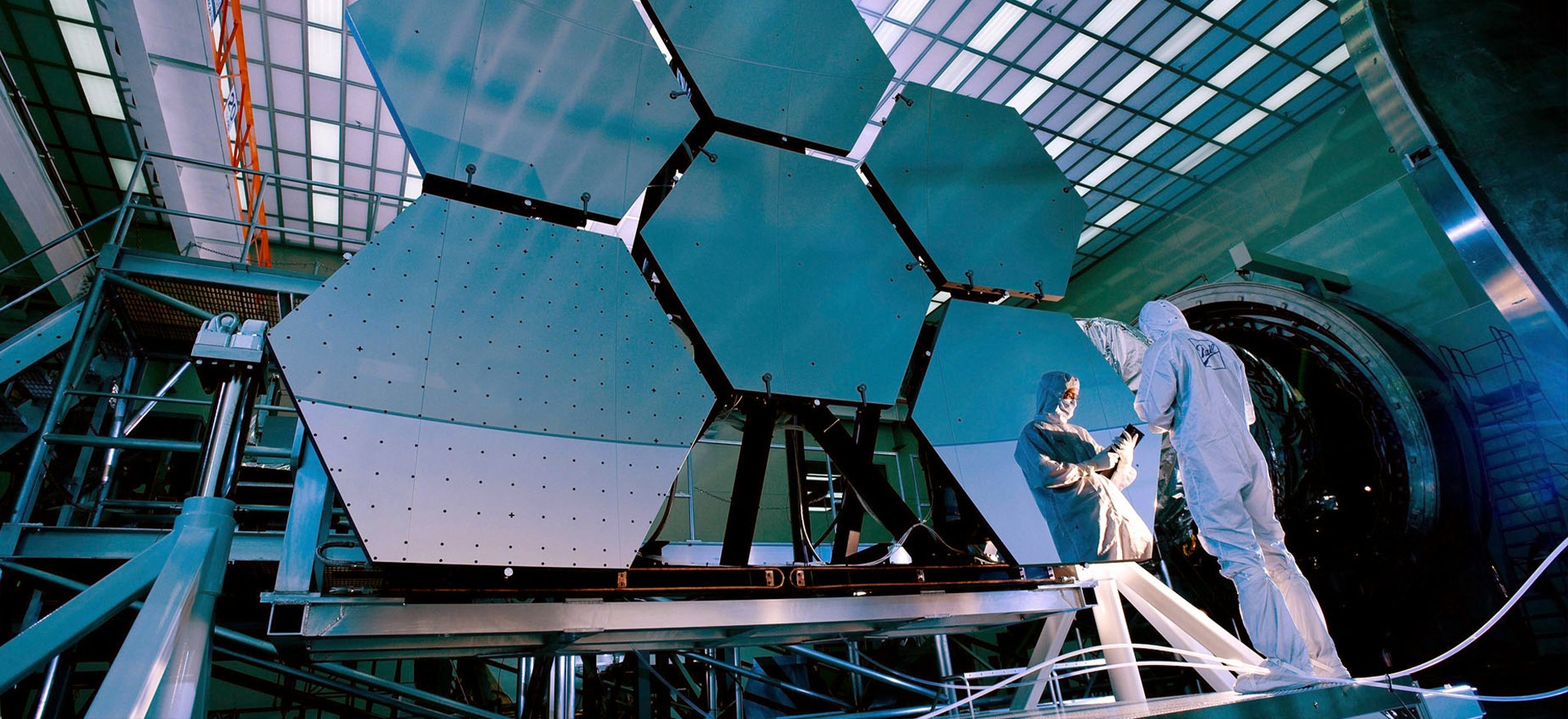Aerospace reflector antenna undergoing testing in a large test facility